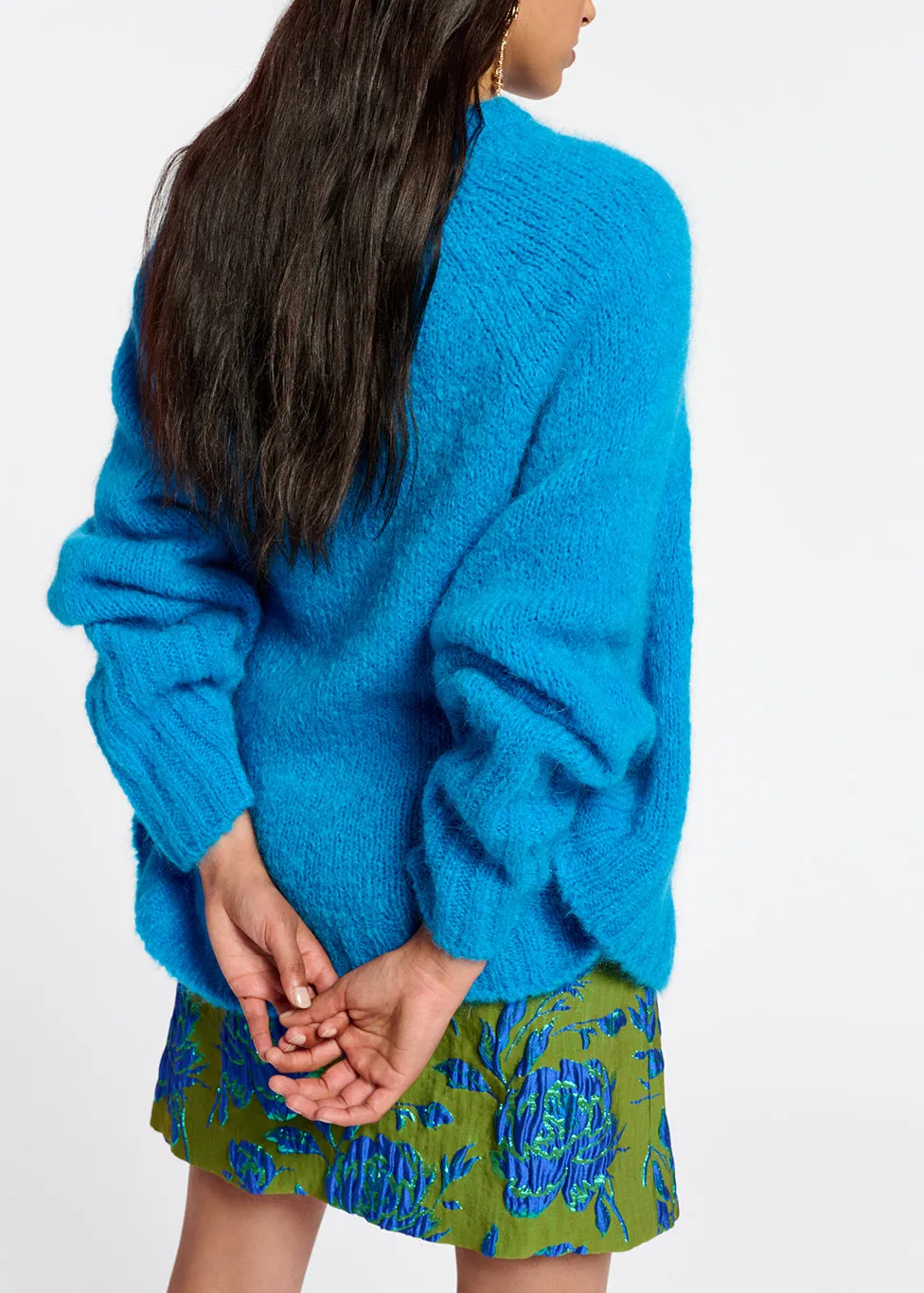 Blue knit sweater with cape effect
