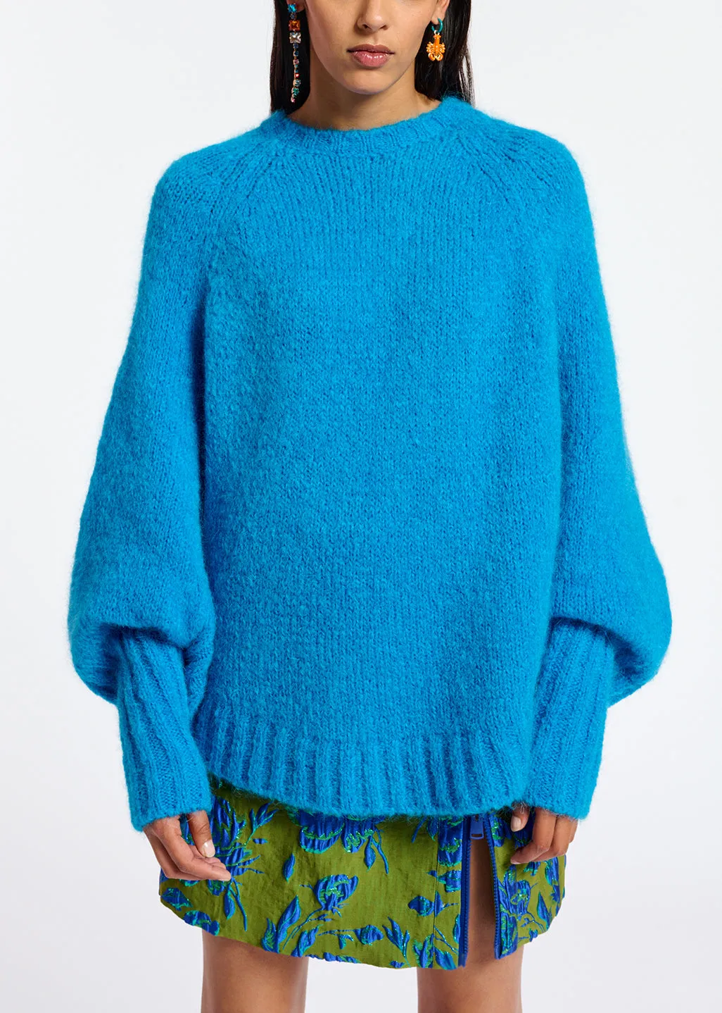 Blue knit sweater with cape effect