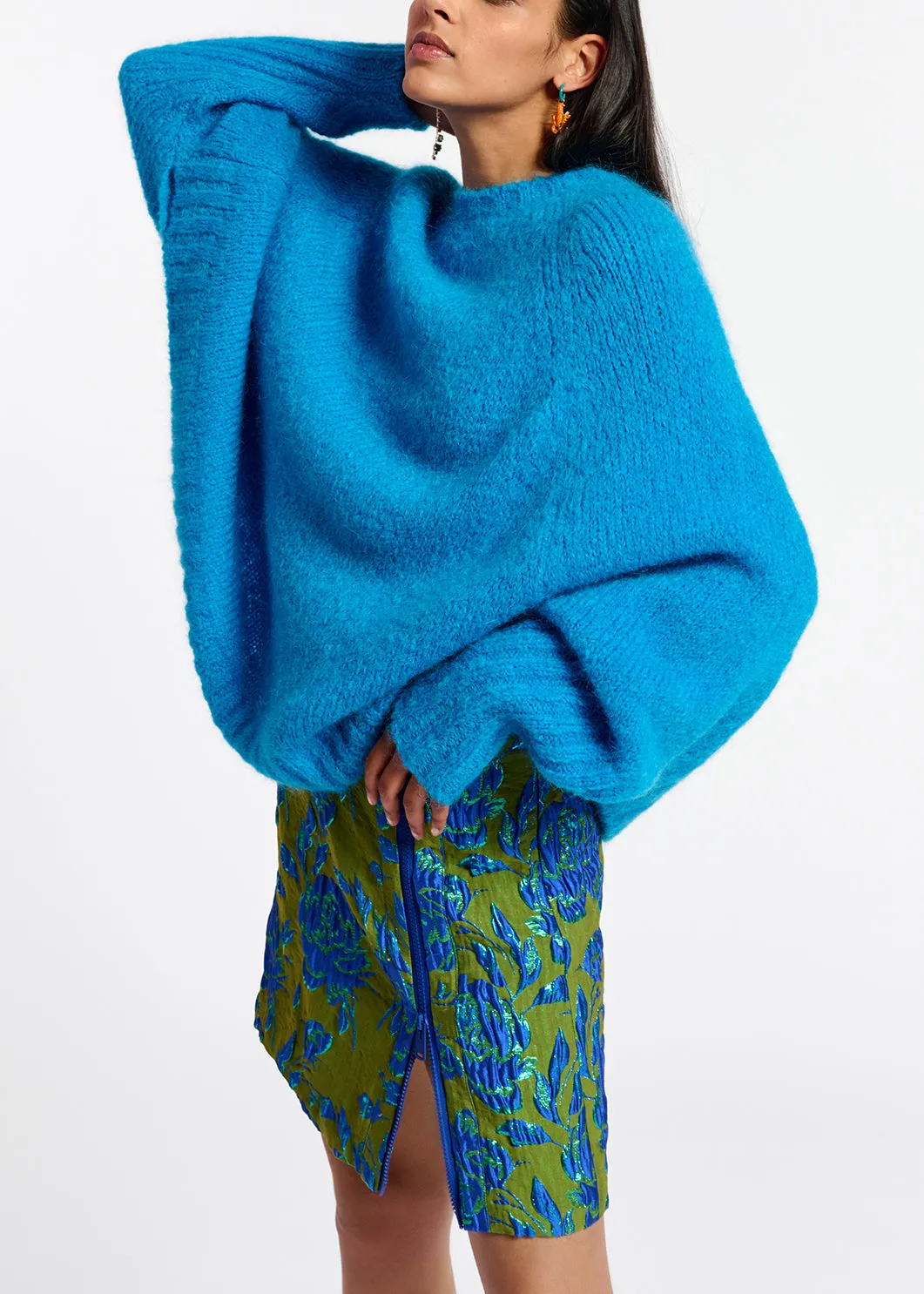 Blue knit sweater with cape effect